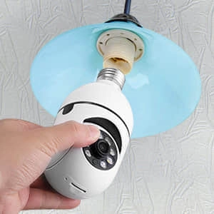 man installing Secure Lite Cam like a light bulb